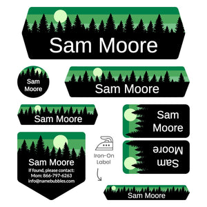overnight camp labels of various shapes and sizes with forest silhouette and sky design